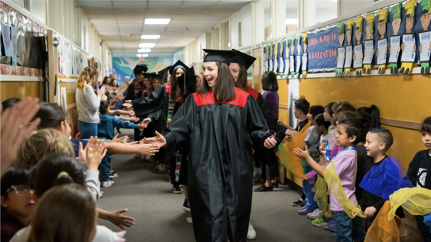 Graduate walking halls of an elementary school Graduate walking halls of an elementary school